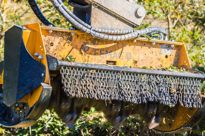 FEMAC forestry mulcher head working in brush